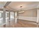Dining room with hardwood floors, chair railing, and an open concept layout at 4770 Spring Park Cir, Suwanee, GA 30024