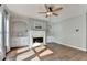 Cozy living room featuring built-in shelving and a classic fireplace at 4770 Spring Park Cir, Suwanee, GA 30024