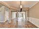 Spacious living area featuring hardwood floors, neutral paint, and an open floor plan at 4770 Spring Park Cir, Suwanee, GA 30024