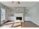 Living room features a fireplace with custom built-ins at 4770 Spring Park Cir, Suwanee, GA 30024