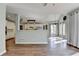 Open concept living area with hardwood floors connected to the kitchen at 4770 Spring Park Cir, Suwanee, GA 30024