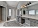 This spacious main bathroom features a double vanity with granite countertop, plus walk-in closet at 4770 Spring Park Cir, Suwanee, GA 30024