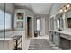 Main bathroom featuring double vanity with granite countertop, walk-in closet, glass enclosed shower, and soaking tub at 4770 Spring Park Cir, Suwanee, GA 30024