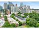 A captivating aerial view of a residential area with downtown high rises in the background at 1055 Piedmont Ne Ave # 106, Atlanta, GA 30309