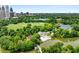 A park and a swimming pool surrounded by luscious greenery with the city skyline in the distance at 1055 Piedmont Ne Ave # 106, Atlanta, GA 30309
