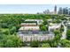 Aerial view of community, surrounding trees, and the city skyline at 1055 Piedmont Ne Ave # 106, Atlanta, GA 30309