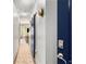 Hallway with hardwood floors and an indigo barn door at 1055 Piedmont Ne Ave # 106, Atlanta, GA 30309