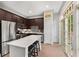 A view of the kitchen featuring an island, stainless steel appliances, and a sliding glass door at 1055 Piedmont Ne Ave # 106, Atlanta, GA 30309