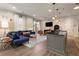 Stylish living room with hardwood floors, comfortable seating, and kitchen island at 1055 Piedmont Ne Ave # 106, Atlanta, GA 30309