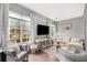 Bright living room featuring hardwood floors, large windows, and elegant furnishings at 1055 Piedmont Ne Ave # 106, Atlanta, GA 30309