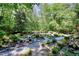 Backyard garden area featuring gravel paths and lush foliage at 4853 Carlene Sw Way, Lilburn, GA 30047