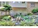 Delightful backyard with a decorative fountain and charming landscaping at 4853 Carlene Sw Way, Lilburn, GA 30047