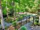 Elevated view of the backyard showing pathways and mature landscaping at 4853 Carlene Sw Way, Lilburn, GA 30047