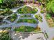 Beautiful backyard exhibiting elegant garden paths, colorful landscaping, and a wonderful deck at 4853 Carlene Sw Way, Lilburn, GA 30047