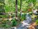 Lush backyard garden with gravel paths and varied landscaping features at 4853 Carlene Sw Way, Lilburn, GA 30047