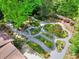 Stunning backyard displaying elegant garden paths, professional landscaping, and mature trees at 4853 Carlene Sw Way, Lilburn, GA 30047