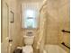 Cozy bathroom featuring a shower-tub combo, decorative shower curtain, and a classic-style window at 4853 Carlene Sw Way, Lilburn, GA 30047