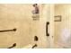 Tiled shower featuring bronze fixtures and a built-in organizer, all combining to create a stylish and efficient space at 4853 Carlene Sw Way, Lilburn, GA 30047