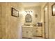 Bathroom with decorative wallpaper and white vanity at 4853 Carlene Sw Way, Lilburn, GA 30047