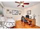 Bedroom features hardwood floors, bright ceiling fan, and a comfortable daybed at 4853 Carlene Sw Way, Lilburn, GA 30047