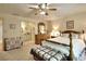 Primary bedroom with ensuite bathroom and ceiling fan at 4853 Carlene Sw Way, Lilburn, GA 30047