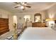Bedroom featuring ceiling fan, ensuite bathroom, and wood furniture at 4853 Carlene Sw Way, Lilburn, GA 30047