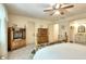 Bedroom featuring ceiling fan, ensuite bathroom, and wood furniture at 4853 Carlene Sw Way, Lilburn, GA 30047