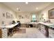 Spacious room with ample table space, ideal for creative projects and organization, enhanced by natural light at 4853 Carlene Sw Way, Lilburn, GA 30047