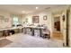A well-lit open space with versatile tables and organized storage, perfect for hobbies and creative pursuits at 4853 Carlene Sw Way, Lilburn, GA 30047