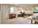 Versatile room featuring multiple tables and soft carpet, designed for comfort and productivity with natural light at 4853 Carlene Sw Way, Lilburn, GA 30047