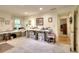 Large craft room with multiple workstations, organized storage, and easy access to the rest of the home at 4853 Carlene Sw Way, Lilburn, GA 30047