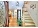 Inviting foyer with hardwood floors, staircase, and elegant glass-paneled front door at 4853 Carlene Sw Way, Lilburn, GA 30047