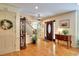 Inviting foyer featuring hardwood floors, an elegant front door, and a decorative staircase at 4853 Carlene Sw Way, Lilburn, GA 30047