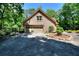 Spacious garage with a large driveway, complemented by attractive landscaping at 4853 Carlene Sw Way, Lilburn, GA 30047