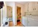Hallway with laundry and half bath at 4853 Carlene Sw Way, Lilburn, GA 30047