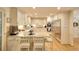 Well-lit kitchen featuring white cabinetry, stainless steel appliances, and granite countertops at 4853 Carlene Sw Way, Lilburn, GA 30047