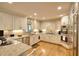 Bright kitchen featuring stainless steel appliances, light cabinetry, and recessed lighting at 4853 Carlene Sw Way, Lilburn, GA 30047