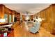 Bright living room boasts wood paneling, built-ins, a fireplace, and hardwood floors at 4853 Carlene Sw Way, Lilburn, GA 30047