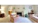 A living area featuring a classic fireplace, comfortable seating, and stylish decor at 4853 Carlene Sw Way, Lilburn, GA 30047