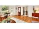 Bright living room with hardwood floors, decorative windows, and a cozy seating area at 4853 Carlene Sw Way, Lilburn, GA 30047