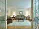 Formal living room with hardwood floors, area rug, a sofa, and decorative lamps at 4853 Carlene Sw Way, Lilburn, GA 30047