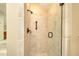 Neutral shower with a glass door, and hand rails on the tile surround at 4853 Carlene Sw Way, Lilburn, GA 30047