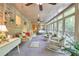 Bright sunroom with brick accent wall, ceiling fans, and lots of natural light at 4853 Carlene Sw Way, Lilburn, GA 30047