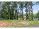 Lush backyard with mature trees offering shade and privacy at 6249 Townsend Way, Riverdale, GA 30296