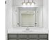 Bathroom features a modern vanity and a large mirror at 6249 Townsend Way, Riverdale, GA 30296