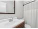 Bathroom featuring a white sink, vanity, mirror, and shower with white curtain at 6249 Townsend Way, Riverdale, GA 30296