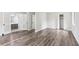 Open bedroom with wood floors and closet, leading to en suite bathroom at 6249 Townsend Way, Riverdale, GA 30296