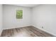Cozy bedroom with hardwood floors and a window offering natural light at 6249 Townsend Way, Riverdale, GA 30296