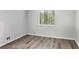 Bright bedroom with hardwood floors and a sun-filled window view at 6249 Townsend Way, Riverdale, GA 30296