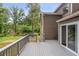 Enjoy the outdoors on this spacious deck with a private backyard view at 6249 Townsend Way, Riverdale, GA 30296